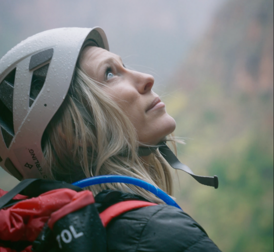 best canyoneering packs 2025 sko gear woman looking up in canyon zions utah behunin